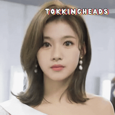 Close Up Woman's Face With Tokingheads GIF