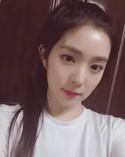 Close-Up Woman Taking Selfie With Hair Bun GIF