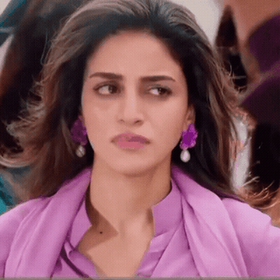 Close Up Woman Wearing Purple Earrings GIF