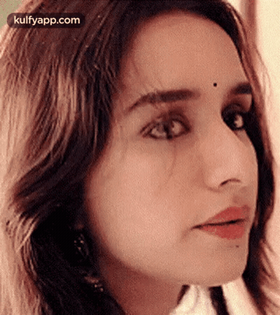 Close Up Woman With Bindi Looking At Camera GIF