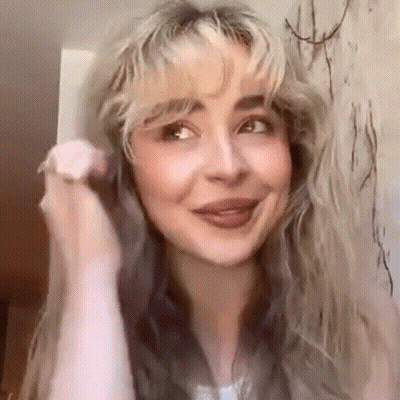 Close-Up Woman With Blonde Bangs Smiling GIF