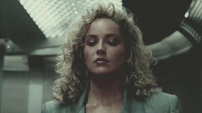 Close Up Woman With Curly Blonde Hair GIF