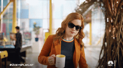 Close Up Woman With Hoop Earrings And Braid GIF