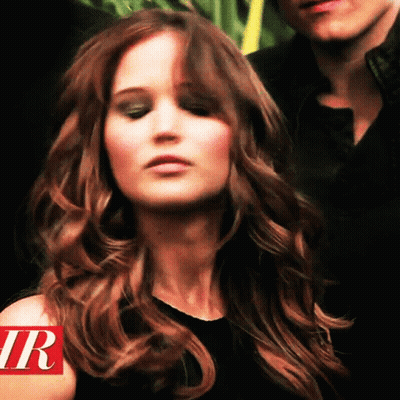 Close Up Woman With Letter R On Shoulder GIF