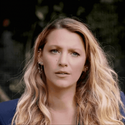 Close Up Woman With Long Blonde Hair And Blue Eyes GIF