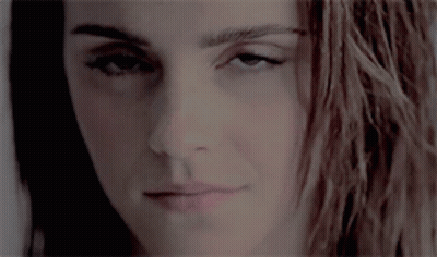 Close-Up Woman With Long Hair Looking At Camera GIF