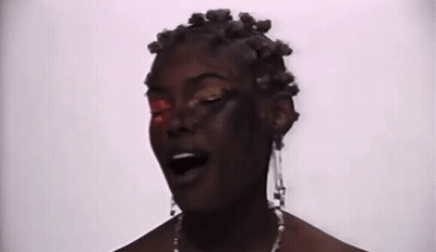 Close Up Woman With Red Eye And Earrings GIF