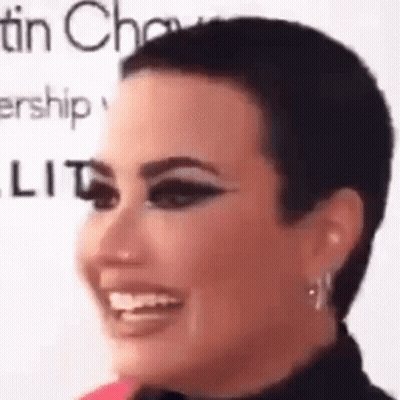Close Up Woman With Shaved Head And Makeup GIF