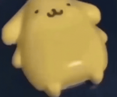 Close Up Yellow Stuffed Animal Floating On Blue Surface GIF