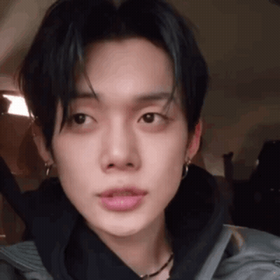 Close Up Young Man In Black Jacket With Earrings GIF