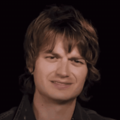 Close Up Young Man's Face Black Background GIF