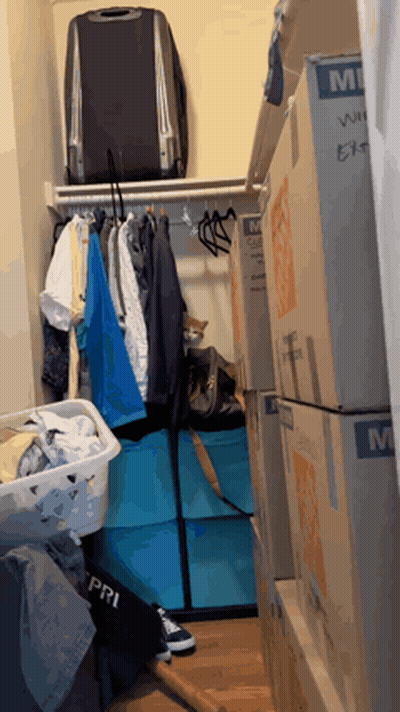 Closet With Boxes And Suitcase Saying MI GIF