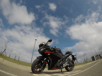 Cloud Time Lapse Featuring A Motorcycle GIF