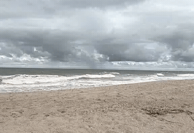 Cloudy Beach With Crashing Waves GIF