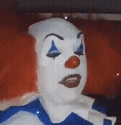 Clown Face With Red Hair And Blue Eyes GIF