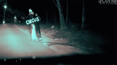 Clown Holding Circus Sign GIF