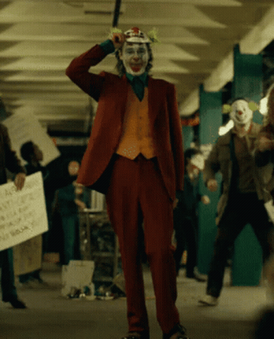 Clown Holding Sign Anyone Who Doesn't Have A Home GIF