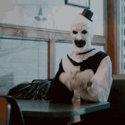 Clown In Top Hat At Diner GIF