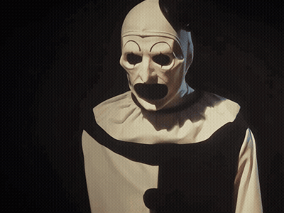 Clown in White and Black Costume With Black Collar Stripe