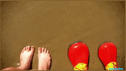 Clown Shoes Beside Barefoot GIF