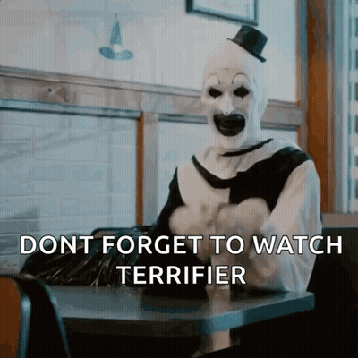 Clown Sitting At Table Dont Forget To Watch Terrifier GIF