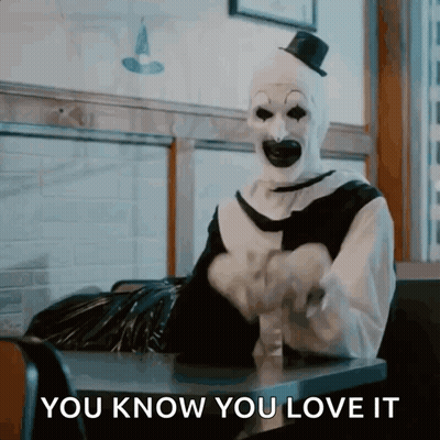 Clown Sitting at Table Saying You Know You Love It