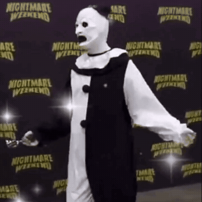 Clown Standing In Front Of Nightmare Weekend Sign GIF
