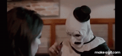 Clown Talking To Woman In Diner GIF