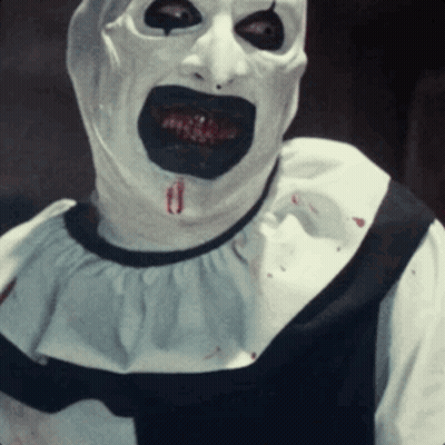 Clown With Blood Coming Out Of Mouth In White And Black Outfit GIF