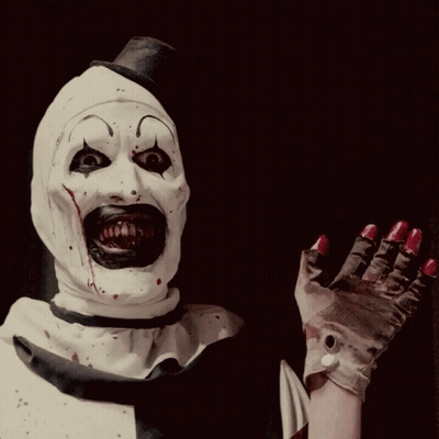 Clown With Blood On Face And Red Nails Waving GIF