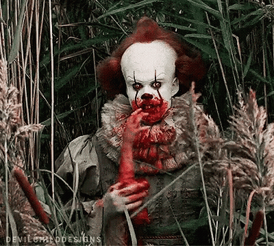 Clown With Blood On Face Eating Chicken GIF