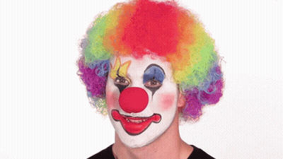 Clown With Rainbow Wig Holding Nose GIF
