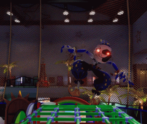 Clown With Red Eyes Standing In Fenced Area GIF