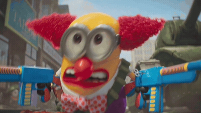 Payaso de pelo rojo y pajarita sosteniendo pistolas de juguete GIF