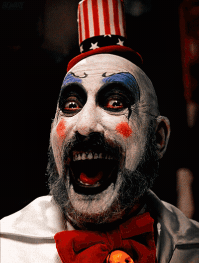 Clown With Red White Blue Top Hat And Bow Tie GIF
