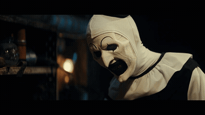 Clown With White Mask Looking At Camera GIF