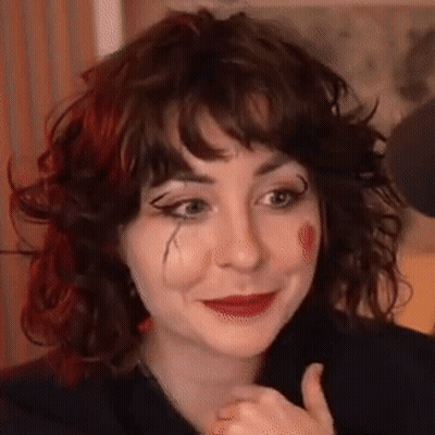 Clown Woman With Curly Hair And Red Lipstick GIF