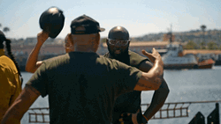 Coast Guard Men Hugging GIF