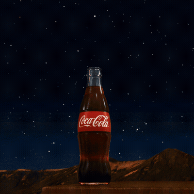 Coca-Cola Bottle Under Starry Night Sky GIF