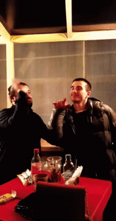 Coca Cola Bottle With Two Men GIF