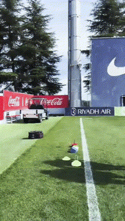 Coca Cola Truck Parked In Front Of Nike Sign GIF