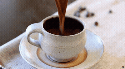 Coffee Being Poured Into Cup On Saucer GIF