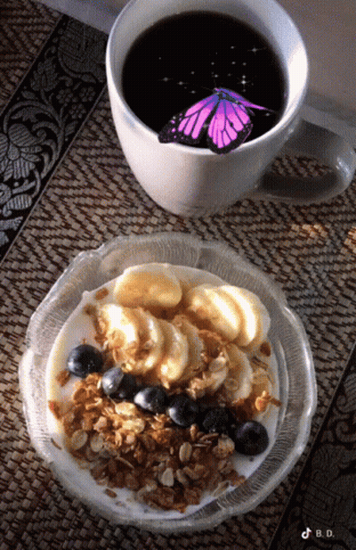 Coffee Cup Next To Bowl Of Granola GIF