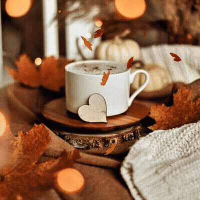 Coffee Cup On Wooden Saucer With Falling Leaves GIF