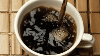 Coffee Poured Into Cup On Wooden Table GIF