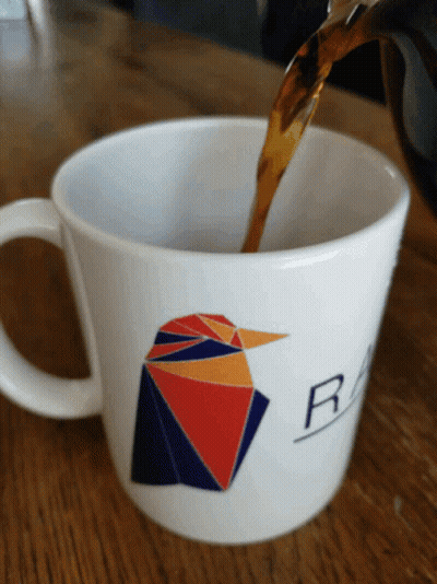 Coffee Poured Into White Mug With Bird And Letter R GIF