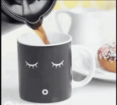 Coffee Pouring Into Sleeping Face Mug GIF