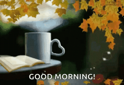 Coffee With Heart Handle Beside Open Book and Leaves