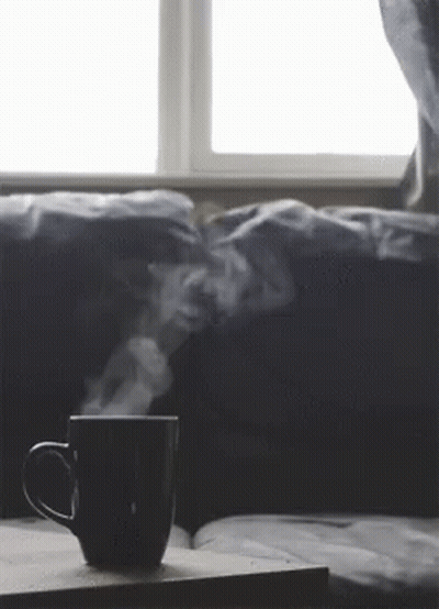 Coffee With Steam On Table By Window GIF