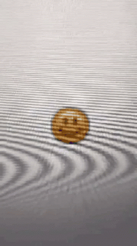 Coin With Smiley Face Floating In Water GIF